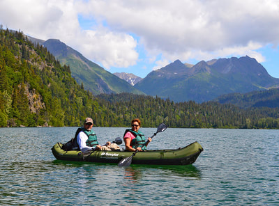A couple kayaking on Leisure Lake in the Kachemak Bay State Park. 